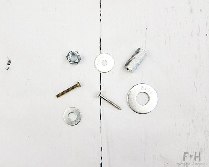 various nuts, bolts and washers on white background