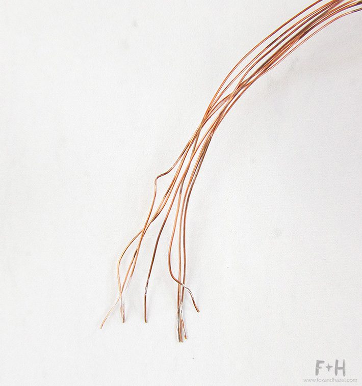 close up of copper wire on white background