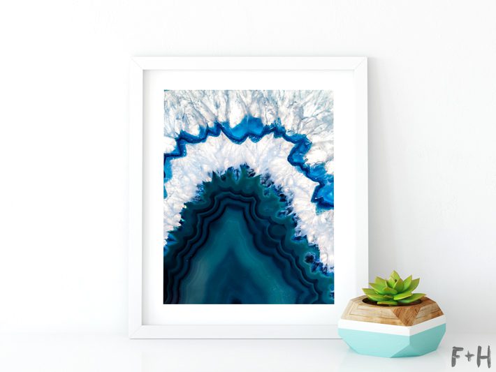 blue agate print in white frame with potted succulent