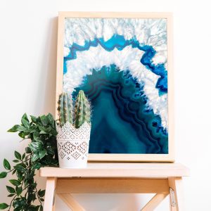 blue agate art print in wood frame on wood stool with plants