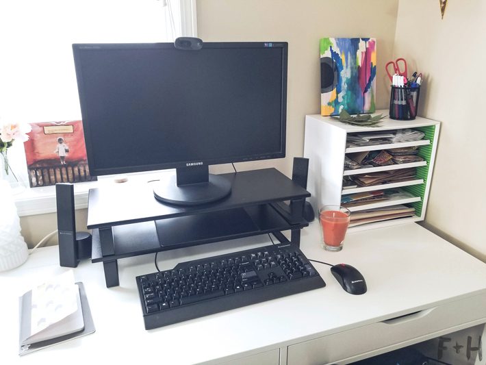 black computer monitor on white ikea desk