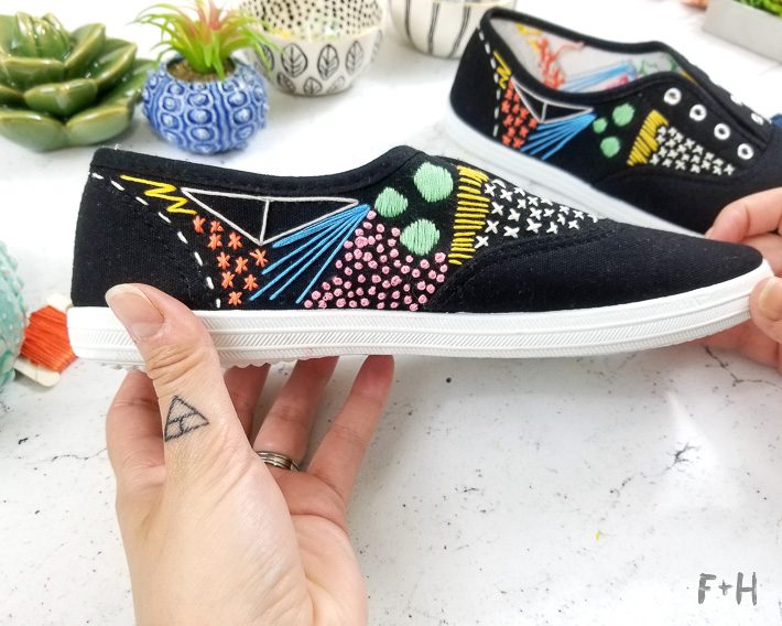 black embroidered canvas shoes on desktop