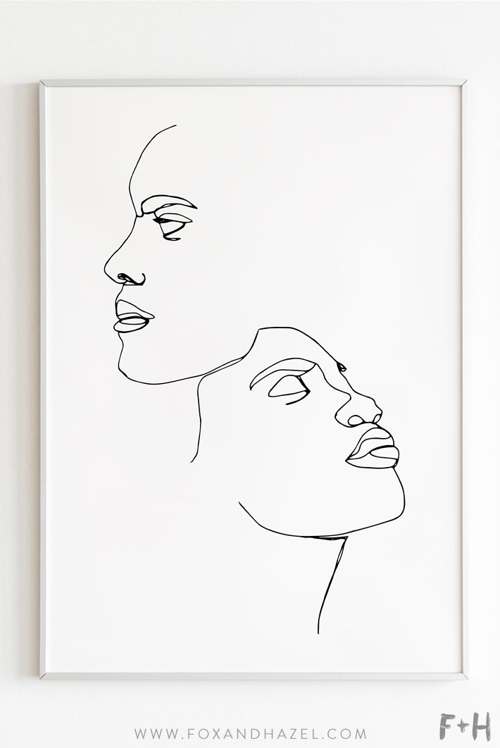 couple line art portrait in white frame on white wall