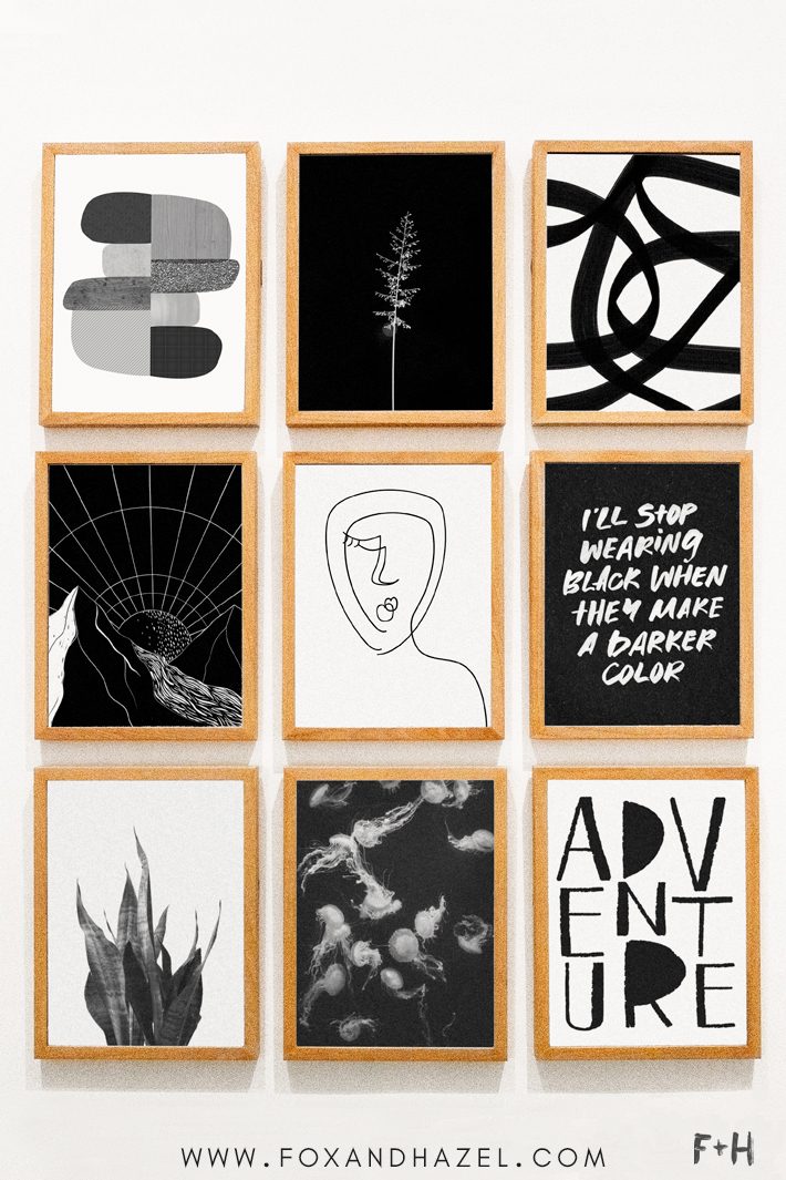 gallery wall of black and white art prints