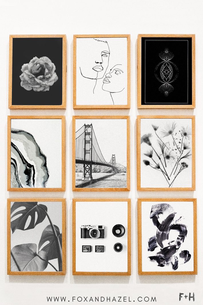 gallery wall of black and white art prints