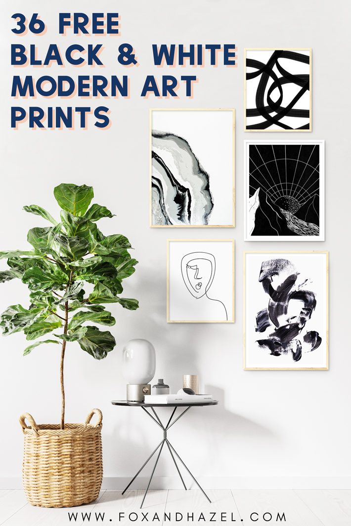 gallery wall of black and white art prints