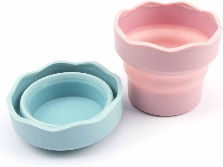 portable art supplies for artists including travel art supplies and a compact art kit for travel with sketchbooks, water brushes, watercolor set, and drawing tools arranged in a travel bag