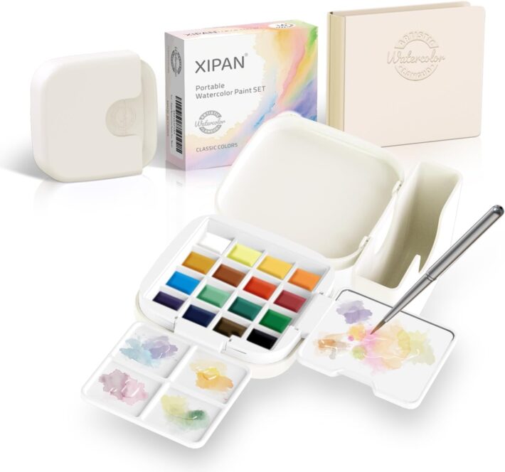 portable art supplies for artists including travel art supplies and a compact art kit for travel with sketchbooks, water brushes, watercolor set, and drawing tools arranged in a travel bag