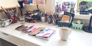 white ikea desk with art supplies